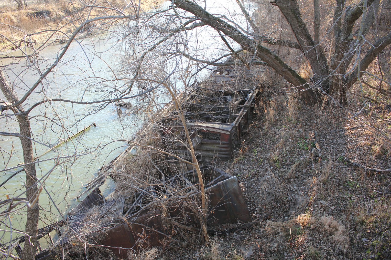 Scrap boxcars used to stabilize river bank